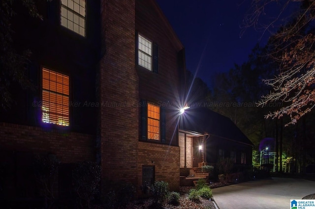 view of property exterior at night