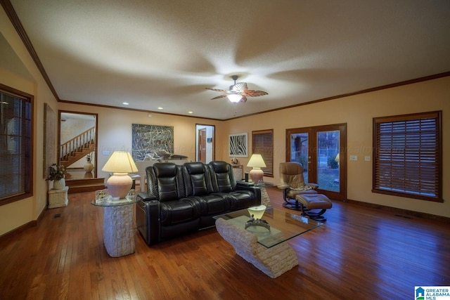 living room with ceiling fan, dark hardwood / wood-style flooring, crown molding, and a textured ceiling