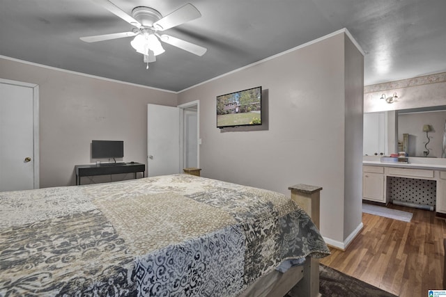 bedroom with dark hardwood / wood-style floors, ensuite bath, ceiling fan, and ornamental molding