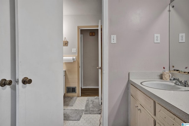 bathroom with tile patterned flooring and vanity