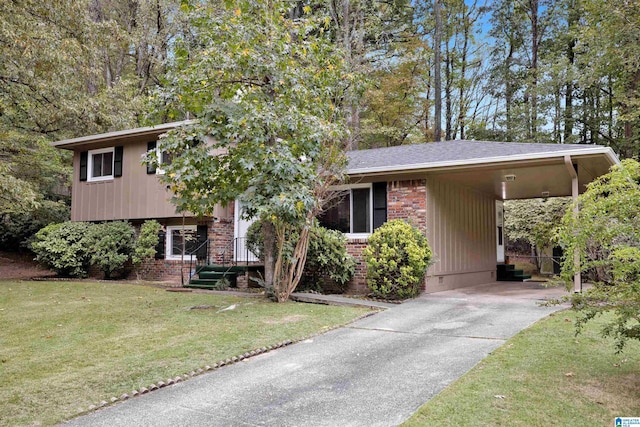 split level home with a front yard and a carport