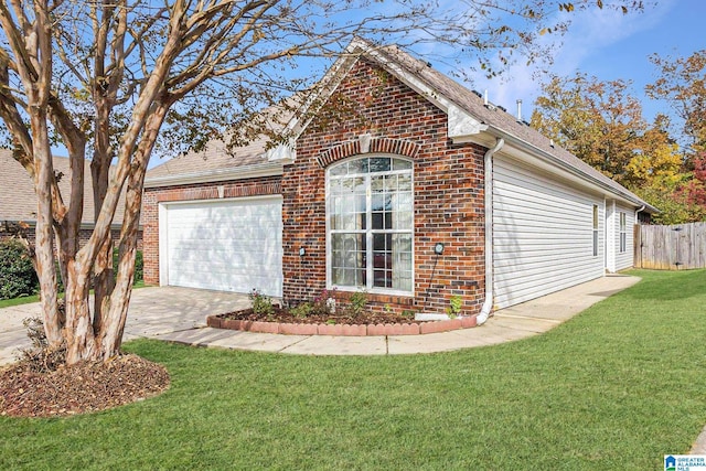 view of side of home with a yard and a garage