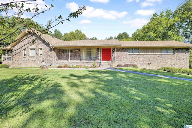 ranch-style home featuring a front yard