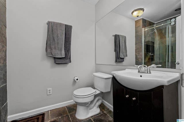 bathroom with vanity, toilet, and an enclosed shower