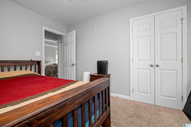 carpeted bedroom featuring a closet