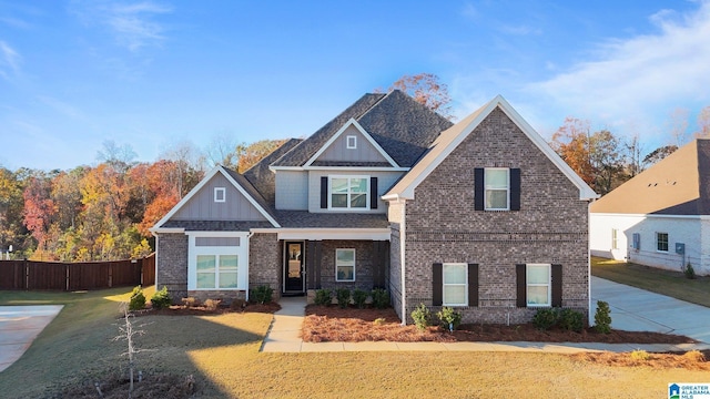 craftsman-style home with a front lawn