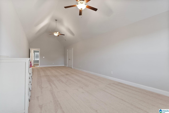 unfurnished living room with ceiling fan, lofted ceiling, and light carpet