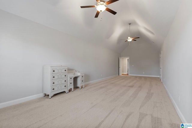 unfurnished living room with ceiling fan, light colored carpet, and vaulted ceiling