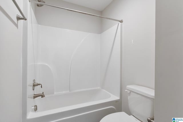 bathroom with shower / bathing tub combination and toilet