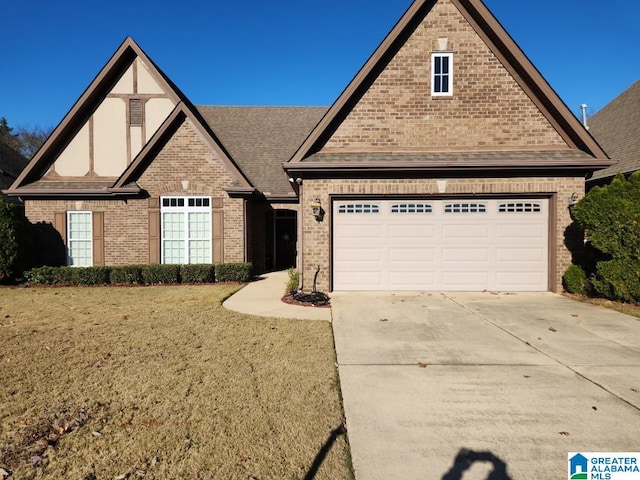 view of front facade featuring a garage and a front lawn