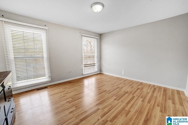 unfurnished room featuring light hardwood / wood-style flooring