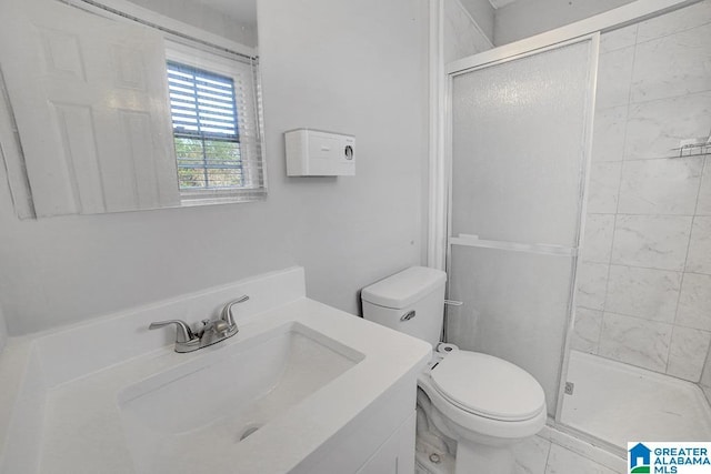 bathroom with vanity, toilet, and walk in shower