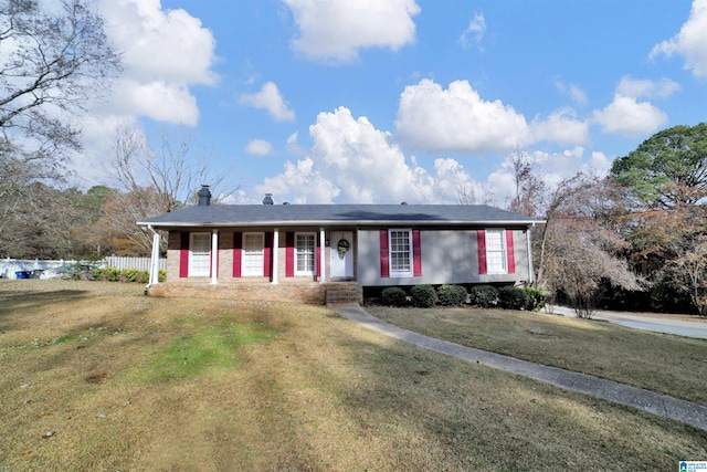 ranch-style home with a front lawn and covered porch