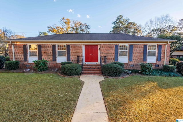 ranch-style house with a front lawn