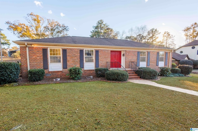 ranch-style home with a front yard