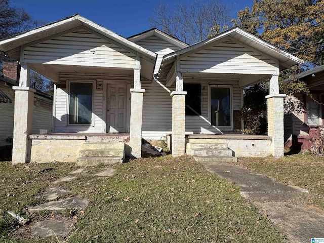 bungalow-style house featuring a front yard and a porch