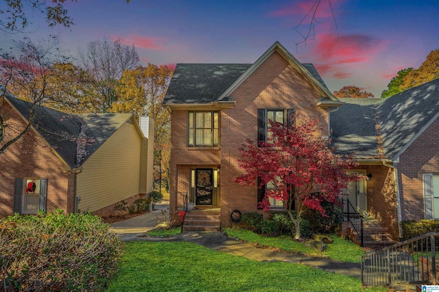 view of front of home with a lawn