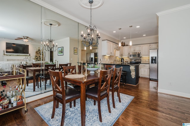 dining area featuring crown molding, dark hardwood / wood-style flooring, and ceiling fan with notable chandelier