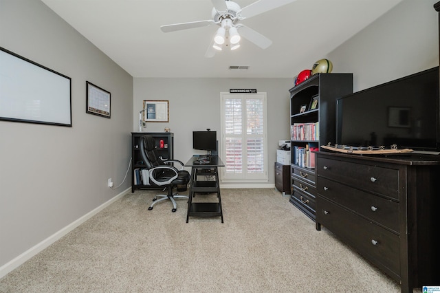 home office with ceiling fan and light colored carpet