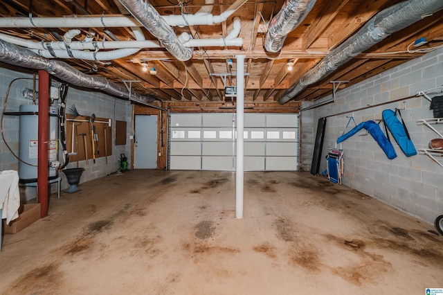 garage featuring water heater and a garage door opener