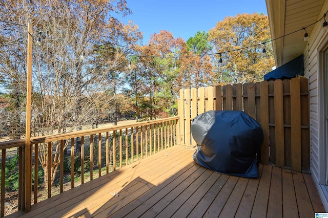 wooden deck featuring grilling area