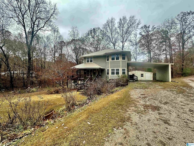 view of front of house featuring a carport and covered porch