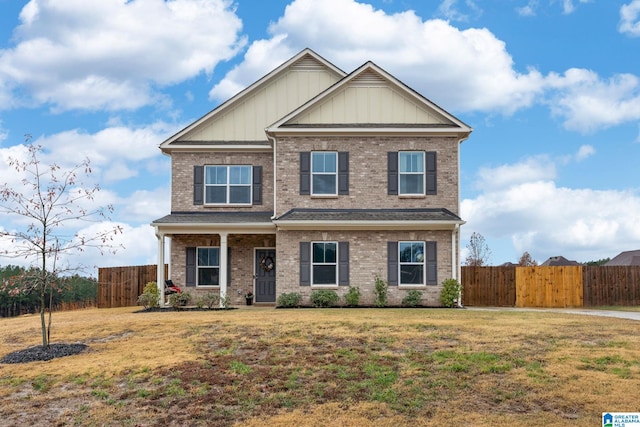 craftsman-style home featuring a front lawn