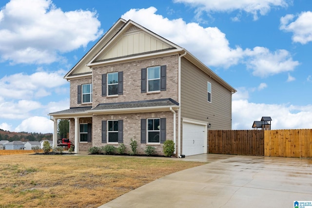 craftsman-style home featuring a front lawn and a garage