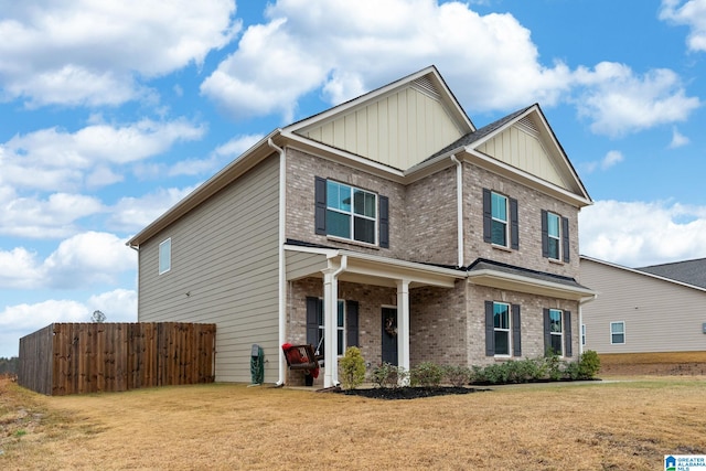 craftsman-style house featuring a front yard