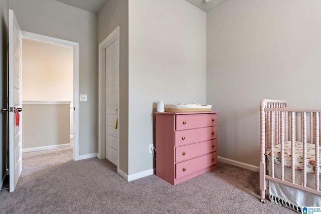 unfurnished bedroom featuring light carpet