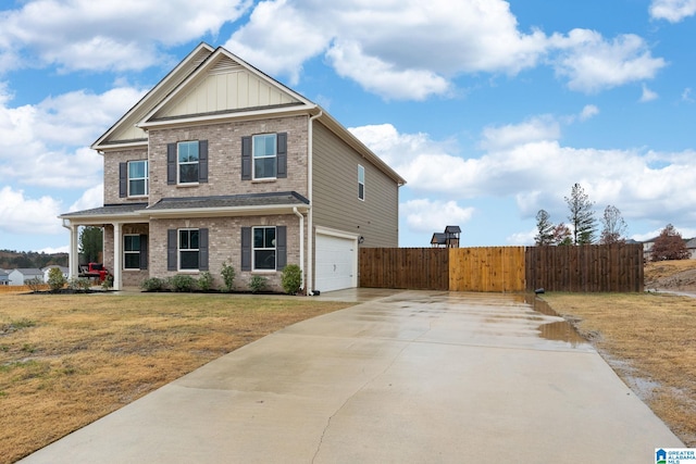 view of front of home featuring a garage and a front lawn