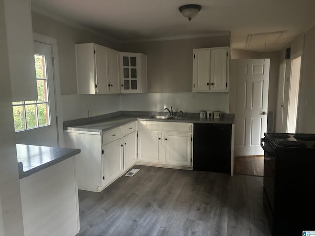 kitchen featuring electric range, dark hardwood / wood-style flooring, white cabinets, and sink