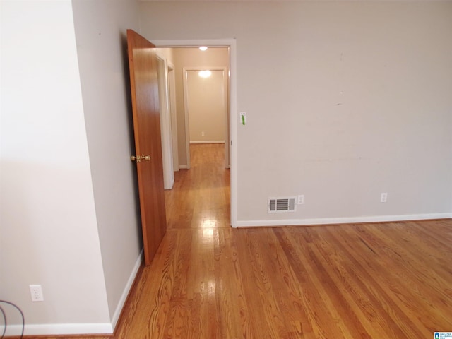 hall with light hardwood / wood-style flooring