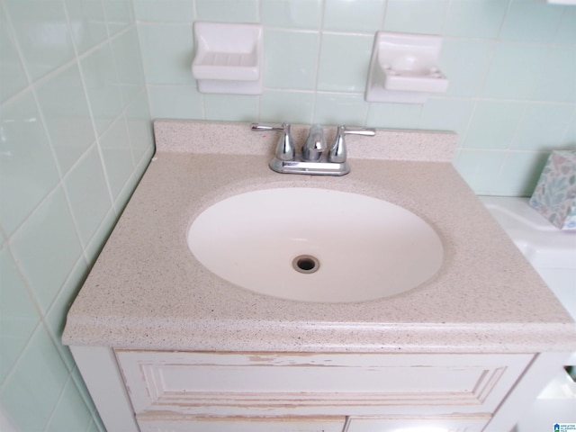 room details with decorative backsplash and vanity