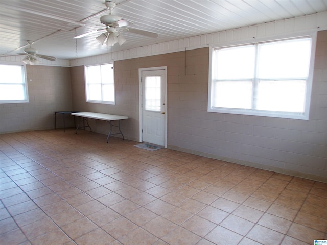 entryway featuring ceiling fan and light tile patterned flooring