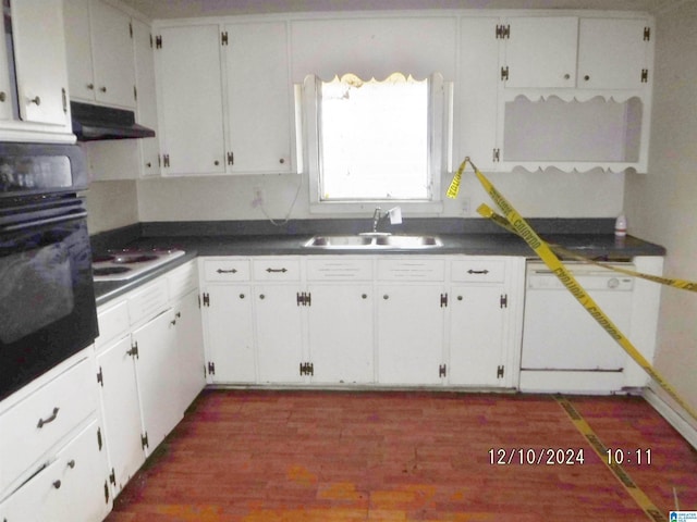 kitchen with dishwasher, dark wood-type flooring, white cabinets, sink, and black oven