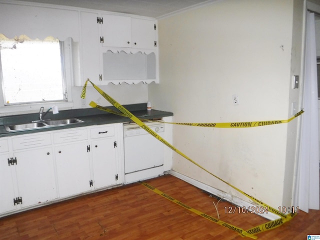 kitchen featuring white dishwasher, white cabinets, dark hardwood / wood-style flooring, and sink