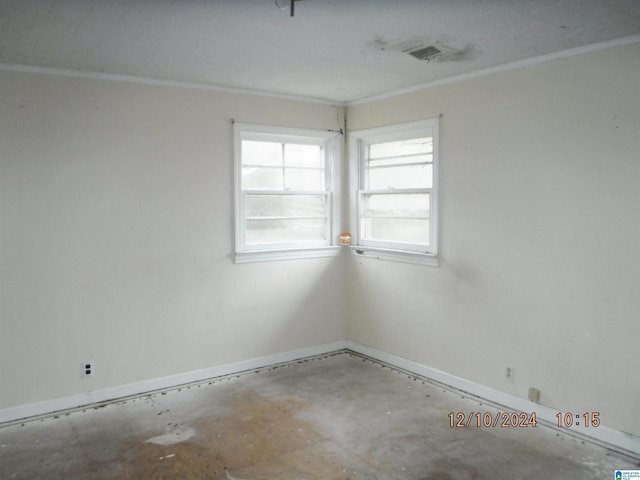 unfurnished room featuring concrete flooring