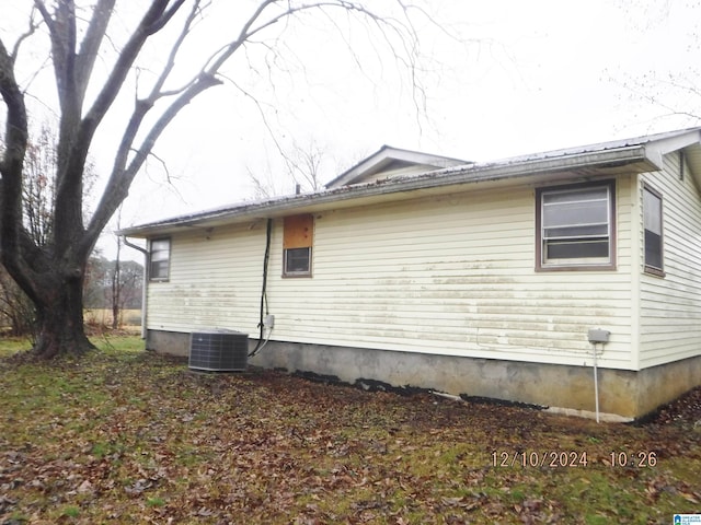 view of side of home featuring central air condition unit