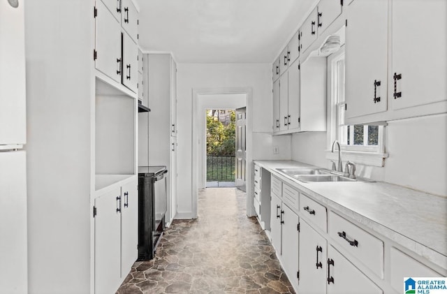 kitchen with white cabinetry and sink