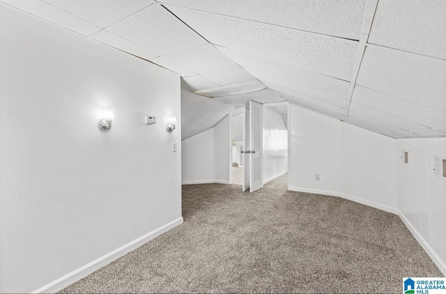 bonus room with carpet and lofted ceiling