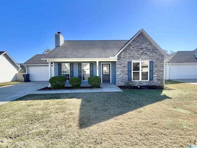 view of front of house with a front yard, a porch, and a garage