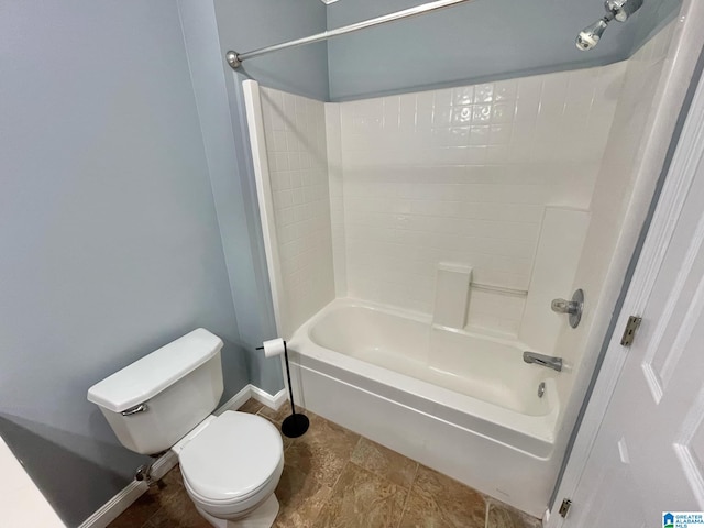 bathroom featuring shower / bath combination and toilet