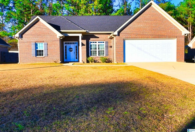 ranch-style house featuring a front yard and a garage