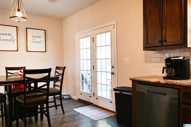 dining space with dark wood-type flooring