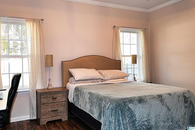 bedroom featuring multiple windows, dark hardwood / wood-style flooring, and crown molding