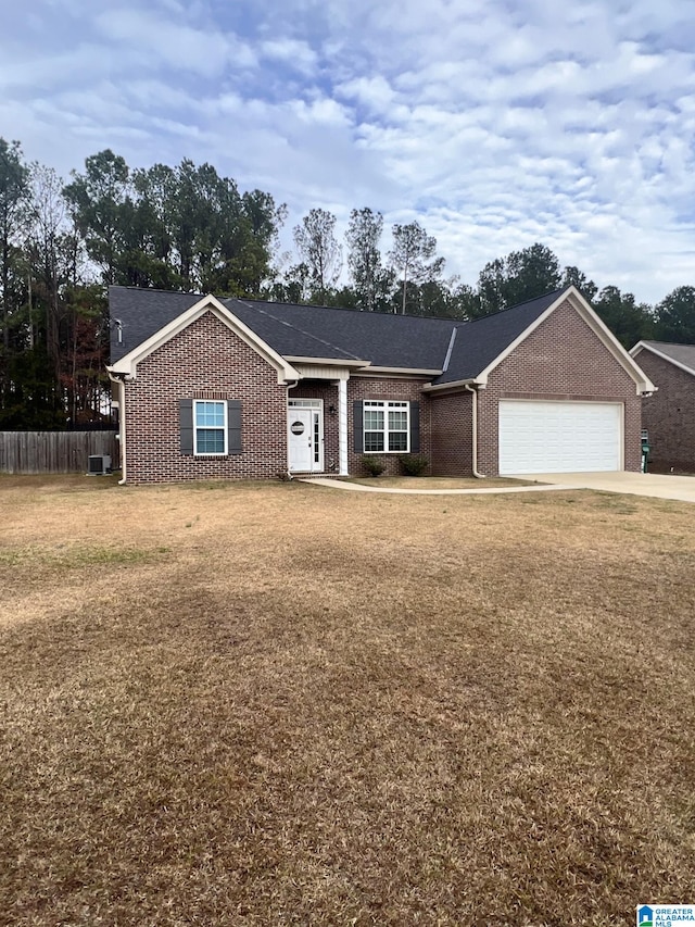 single story home featuring a front yard and a garage