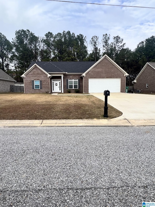 view of front of house with a front lawn and a garage