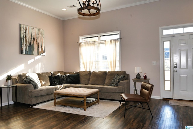 living room featuring dark hardwood / wood-style floors and crown molding