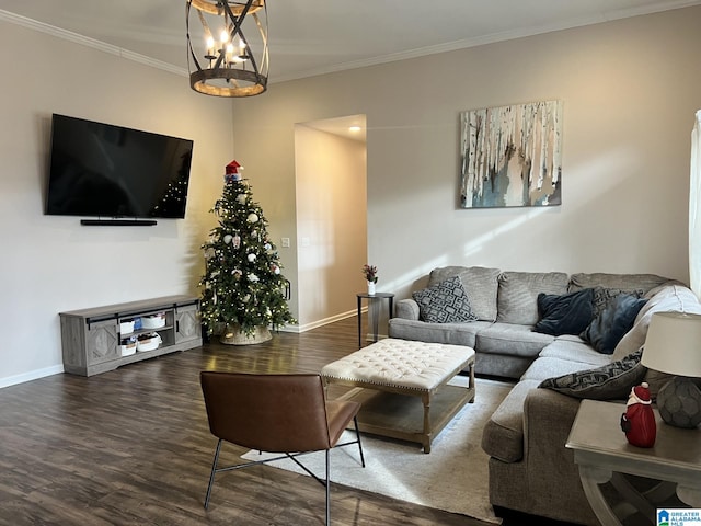 living room featuring dark hardwood / wood-style flooring, crown molding, and a chandelier